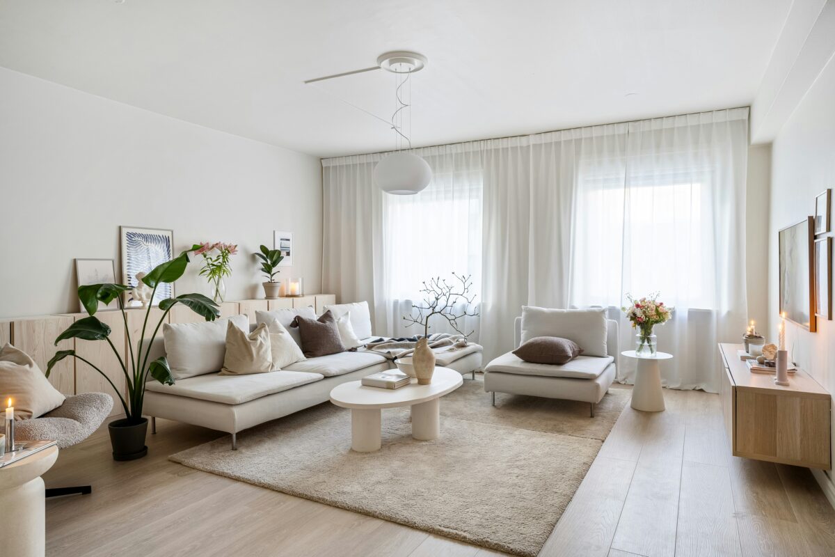Scandinavian-style living room with neutral furniture and soft natural light.