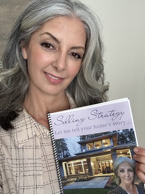 Eugenie Eckler holding a book titled Selling Strategy