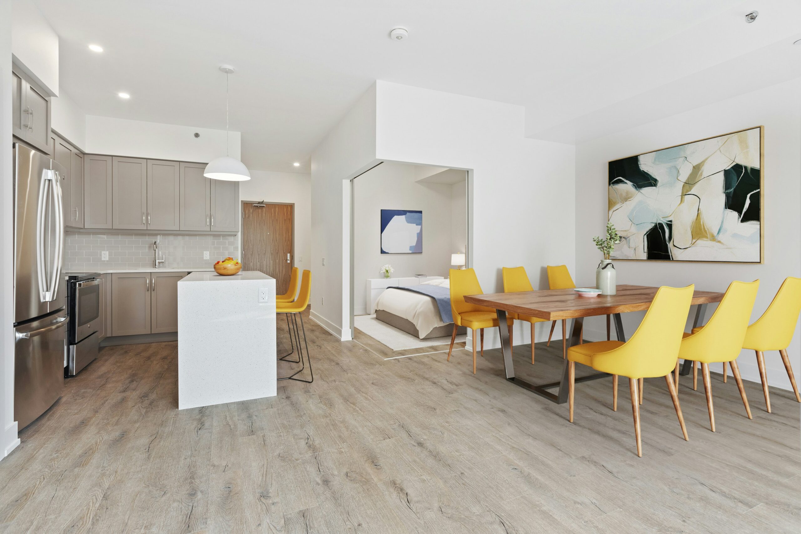 Toronto condo spacious open concept with kitchen, dining room, and corner bedroom