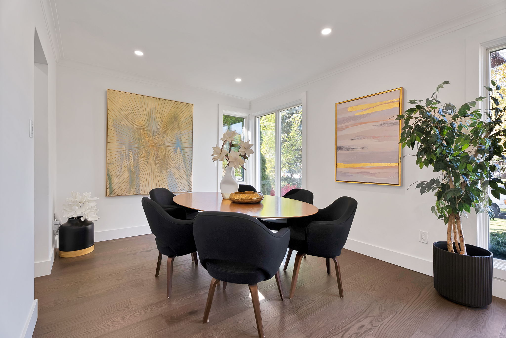 Modern dining room staged with contemporary wall art