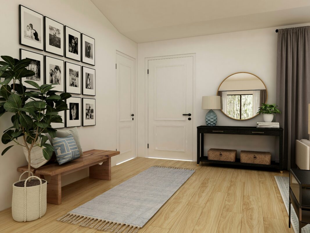 Modern entryway with wooden bench, gallery wall, and console table with mirror.
