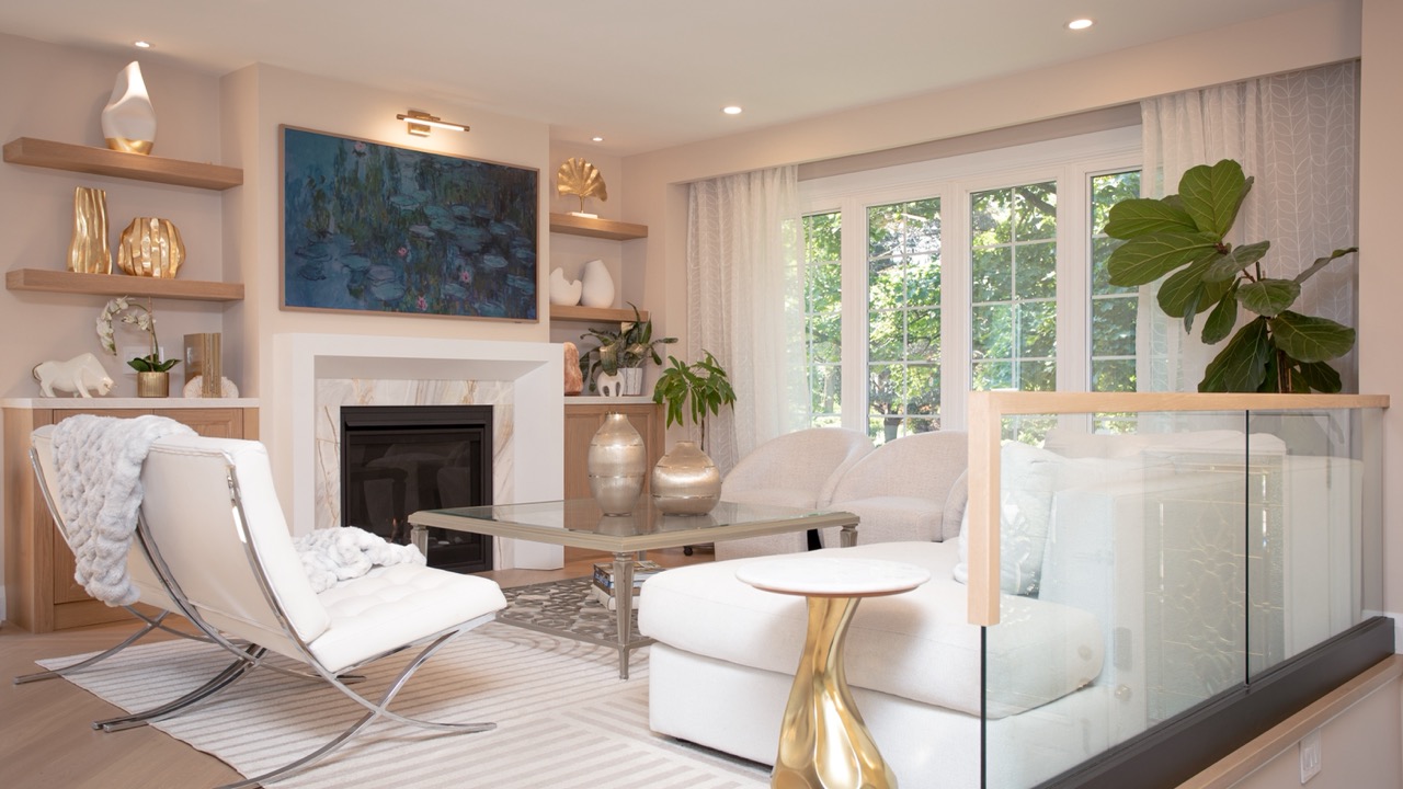 Neutral white living room staged with gold accents